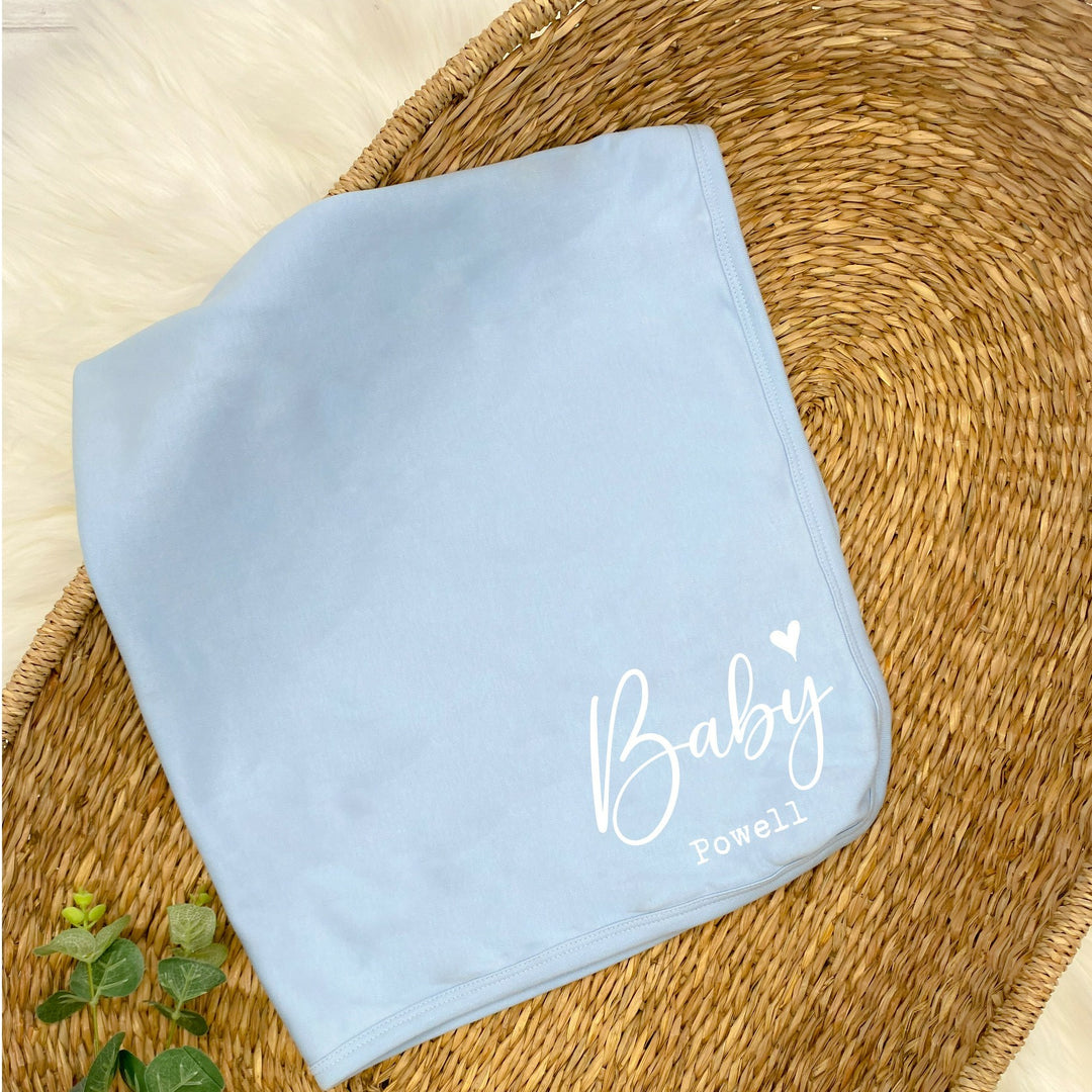 a personalised blue baby blanket that says 'Baby Brown'