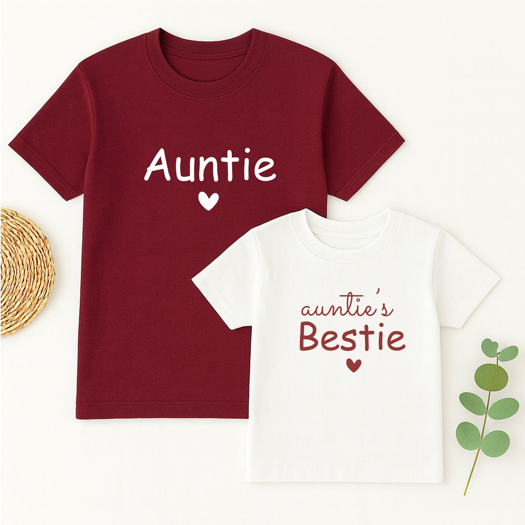 Maroon t-shirt with 'Auntie' and white t-shirt with 'auntie's Bestie' on a light background