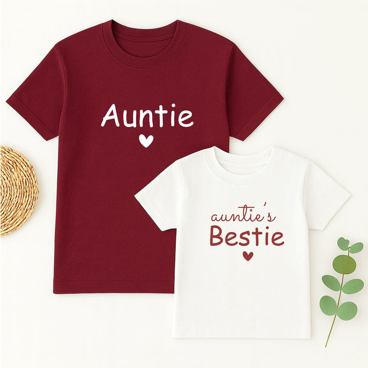 Maroon t-shirt with 'Auntie' and white t-shirt with 'auntie's Bestie' on a light background