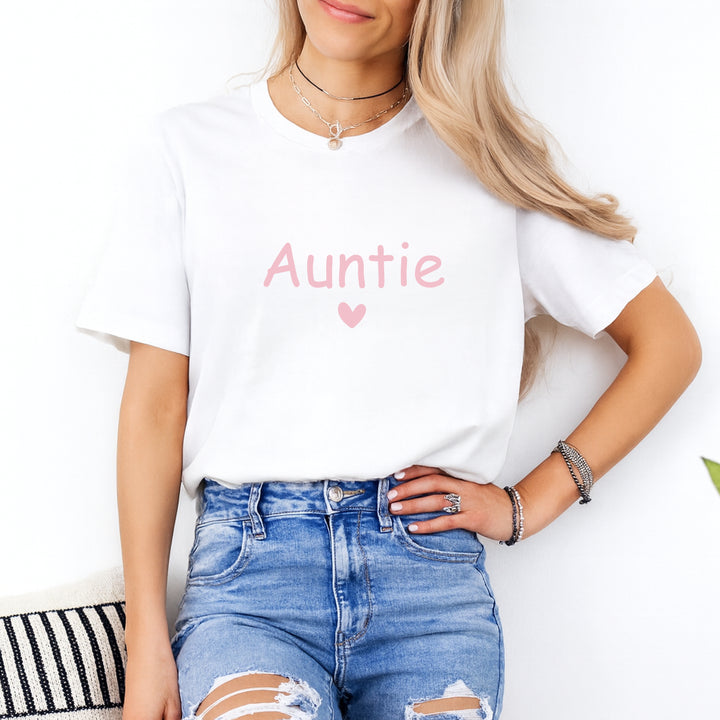Person wearing a white t-shirt with 'Auntie' text and blue jeans on a white background