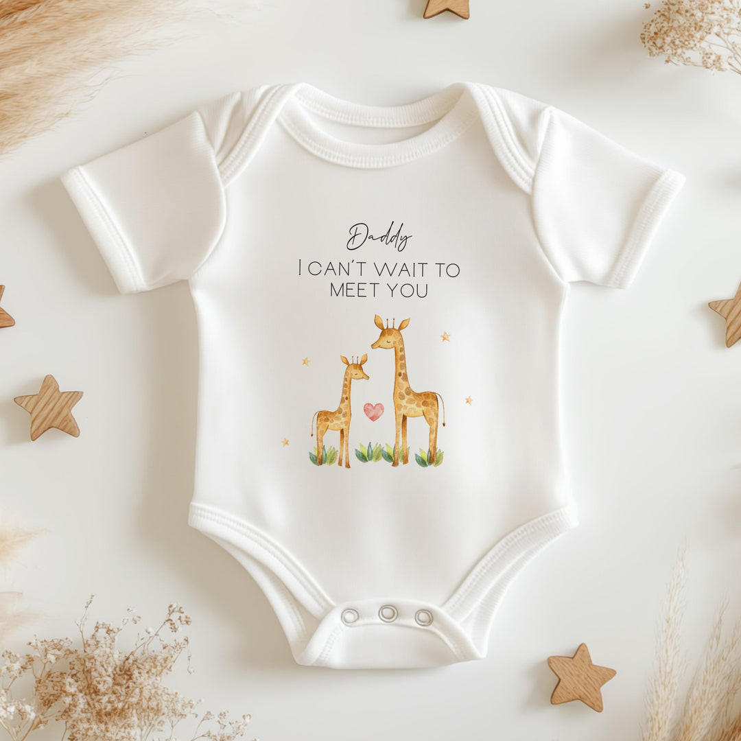 Baby announcement vests that says: Daddy I can't wait to meet you. With a daddy giraffe and a baby giraffe under the text