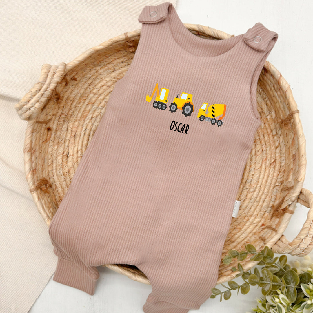 Personalised brown ribbed dungarees that say 'Oliver'. This design features 3 diggers