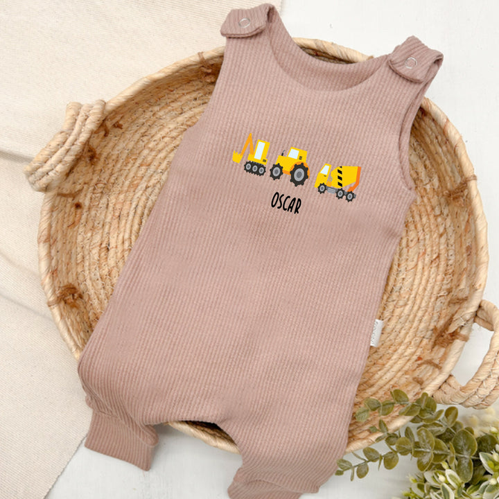 Personalised brown ribbed dungarees that say 'Oliver'. This design features 3 diggers
