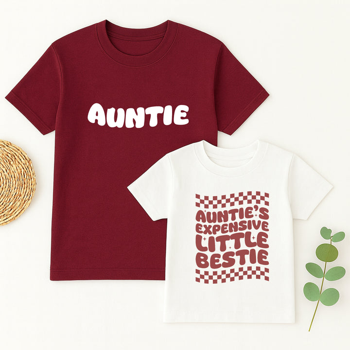 Maroon t-shirt with 'Auntie' text and white t-shirt with red text on a white background.