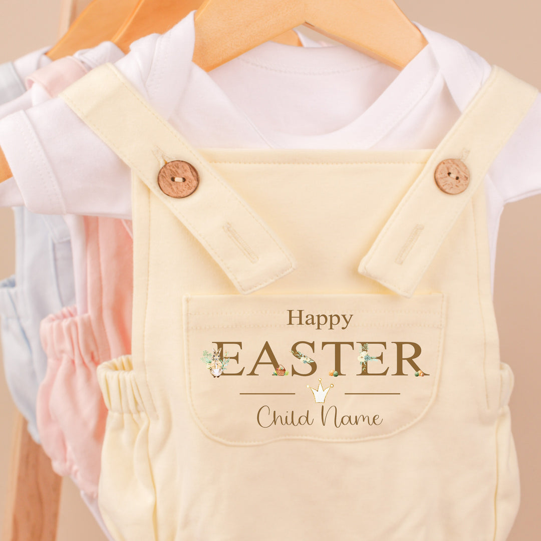 Personalised lemon yellow Easter dungarees that say 'Happy Easter Lilah'. This design features a rabbit wearing a beige jacket