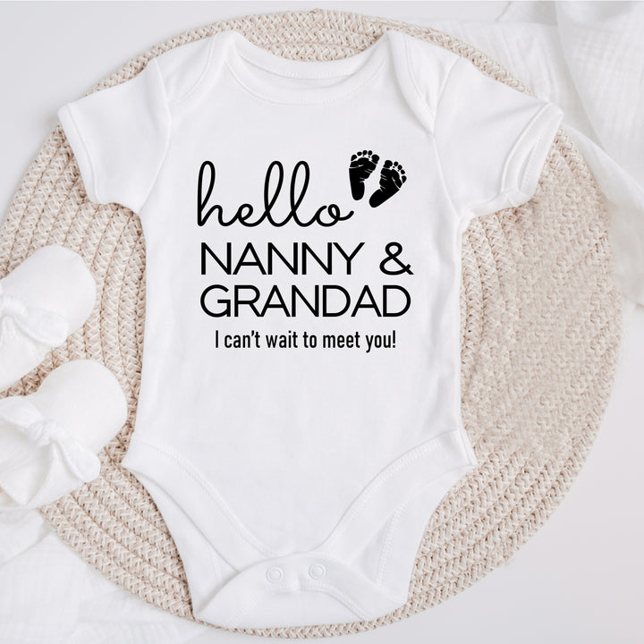 Baby announcement vests that says: Hello Nanny & Grandad I can't wait to meet you! With two baby feet