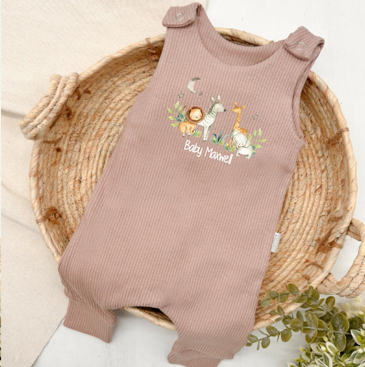 Personalised brown ribbed dungarees that say 'Baby Maxwell'. This design features a jungle scene