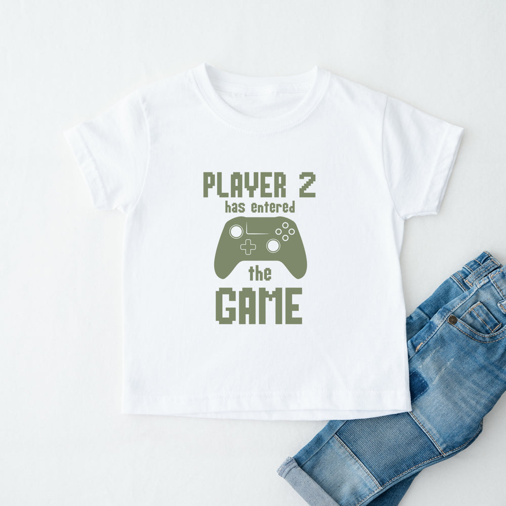 White t-shirt with 'Player 2 has entered the game' text and a green controller graphic, paired with blue jeans on a white background.