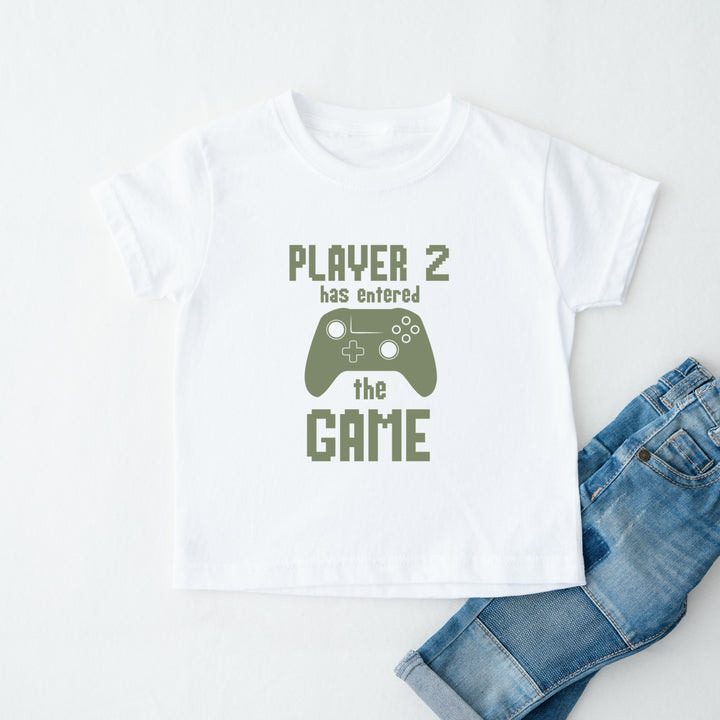 White t-shirt with 'Player 2 has entered the game' text and a green controller graphic, paired with blue jeans on a white background.