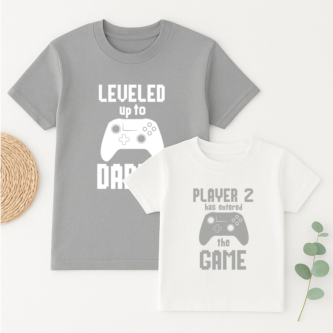 Two t-shirts with gaming-themed text and graphics on a white background.