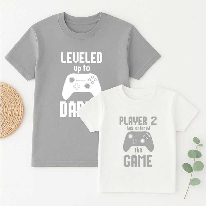 Two t-shirts with gaming-themed text and graphics on a white background.