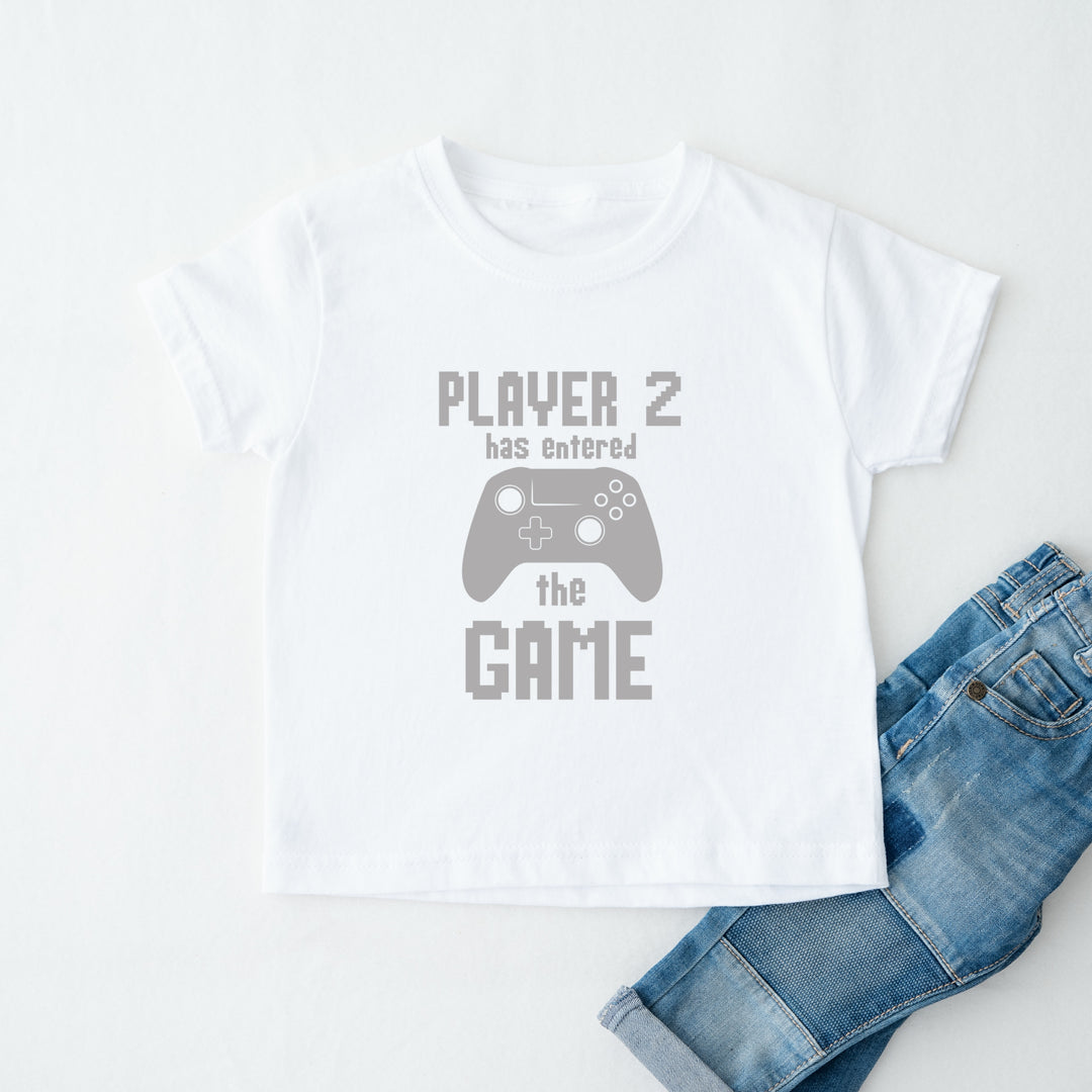 White t-shirt with 'Player 2 has entered the game' text and a controller graphic, paired with blue jeans on a white background.