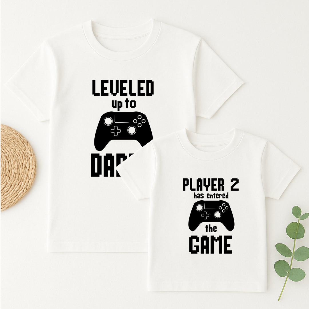 White tank top with gaming-themed text and controller graphics on a white background.