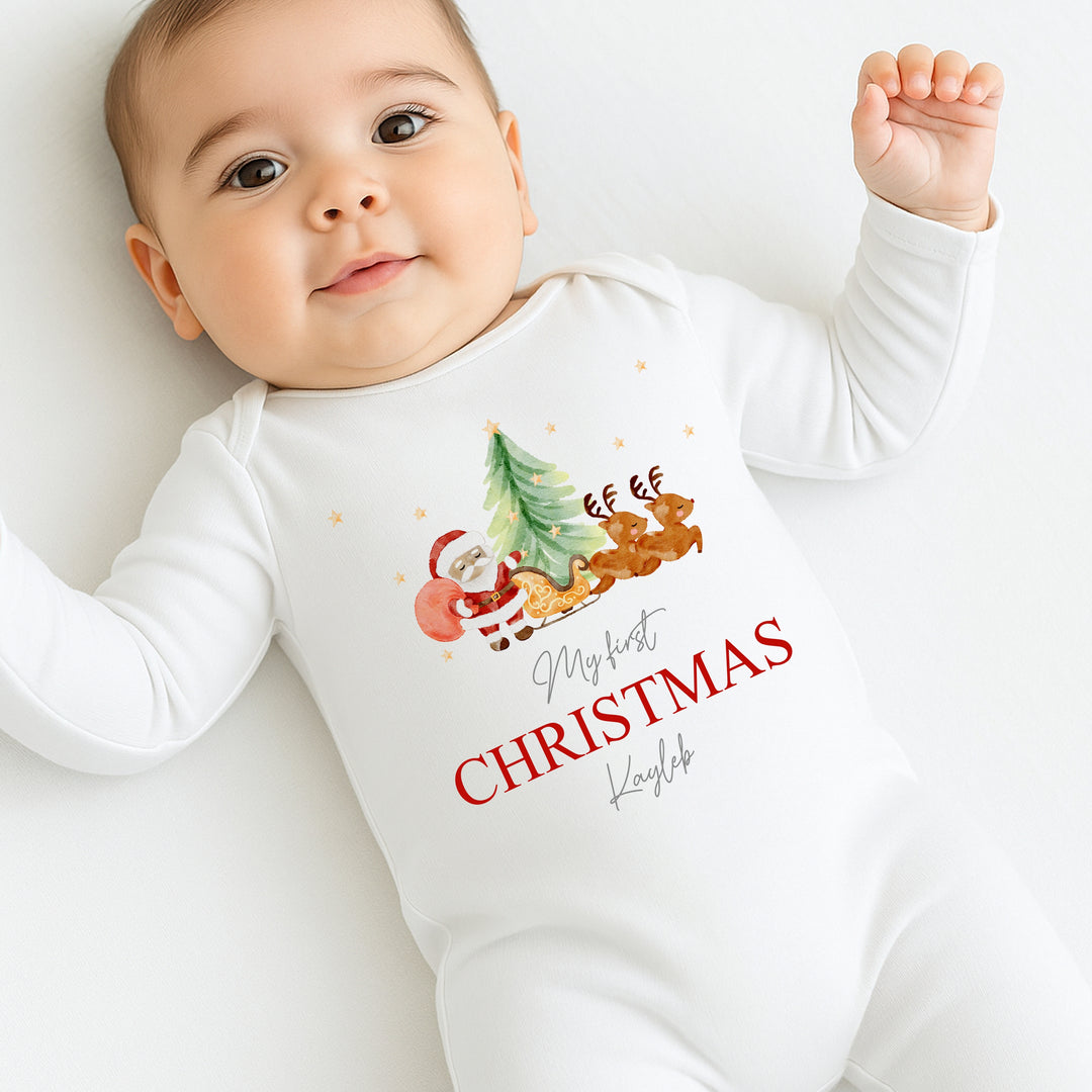 Baby wearing a 'My first Christmas' onesie with festive design