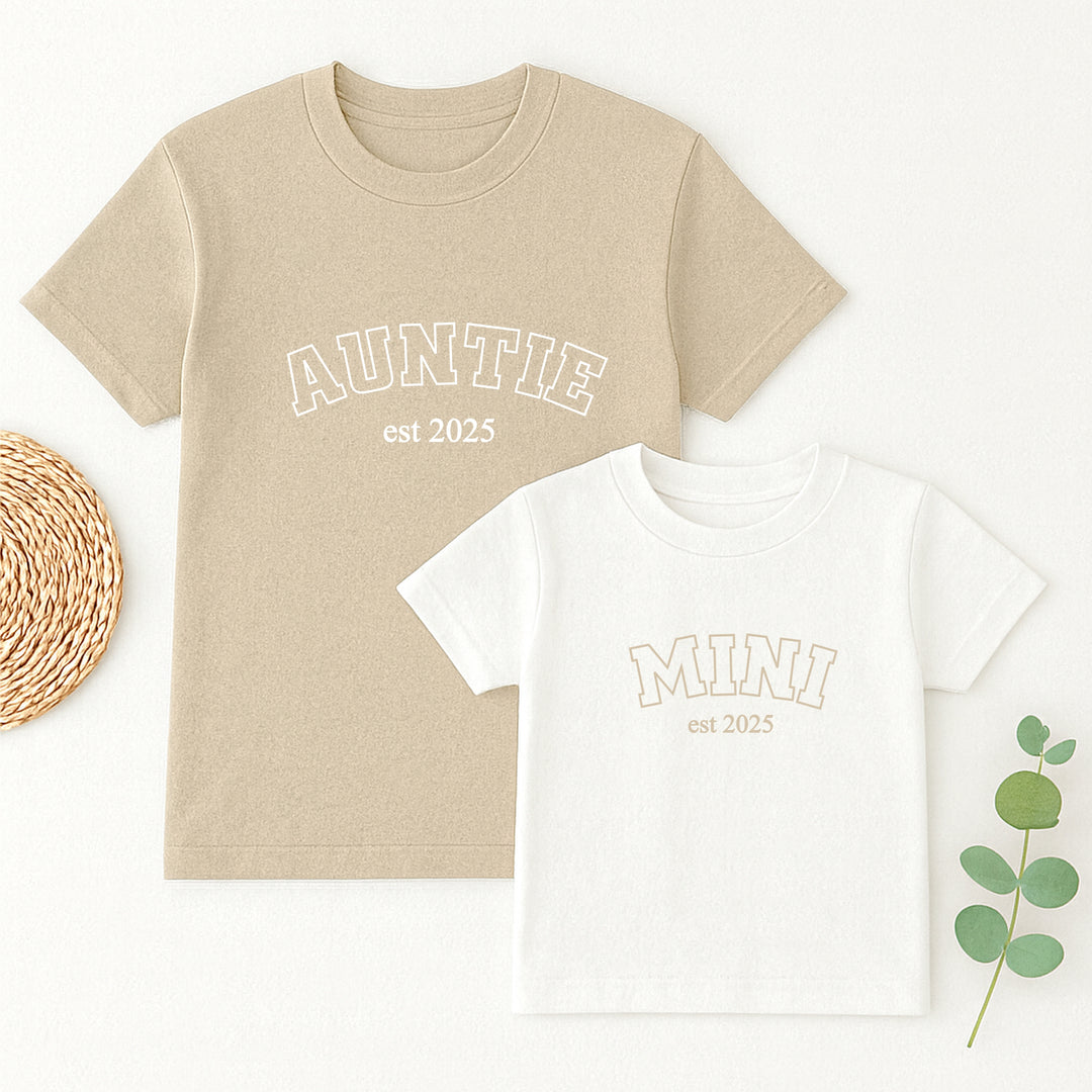 Beige and white t-shirts with 'Auntie est. 2025' and 'Mini est. 2025' text on a white background.