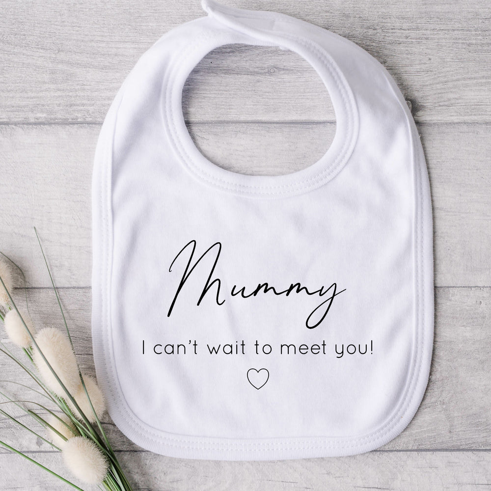 Baby bib that says: Mummy I can't wait to meet you! With a small heart under