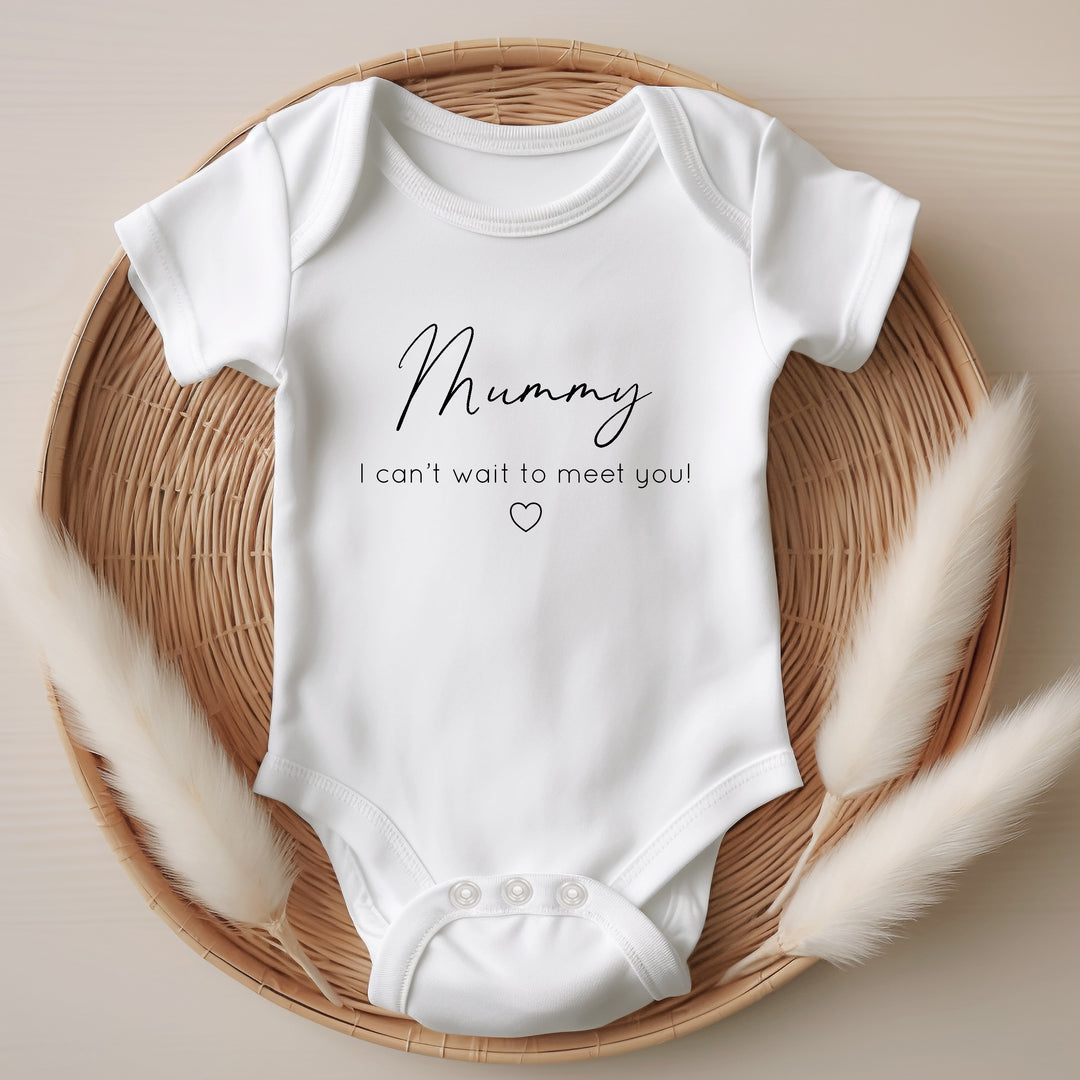 Baby announcement vests that says: Mummy I can't wait to meet you! With a small heart under