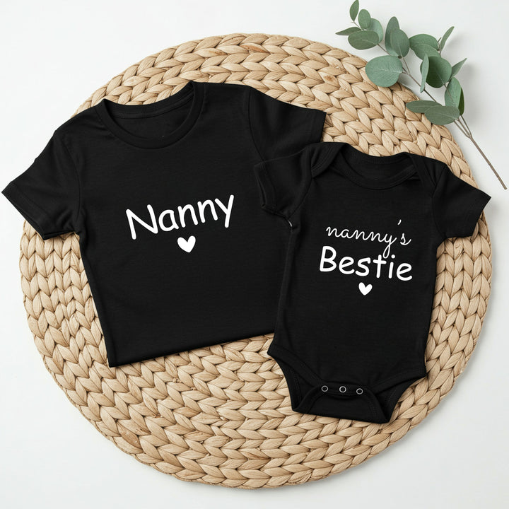 Black t-shirt and baby onesie with 'Nanny' and 'nanny's Bestie' text on a woven mat.