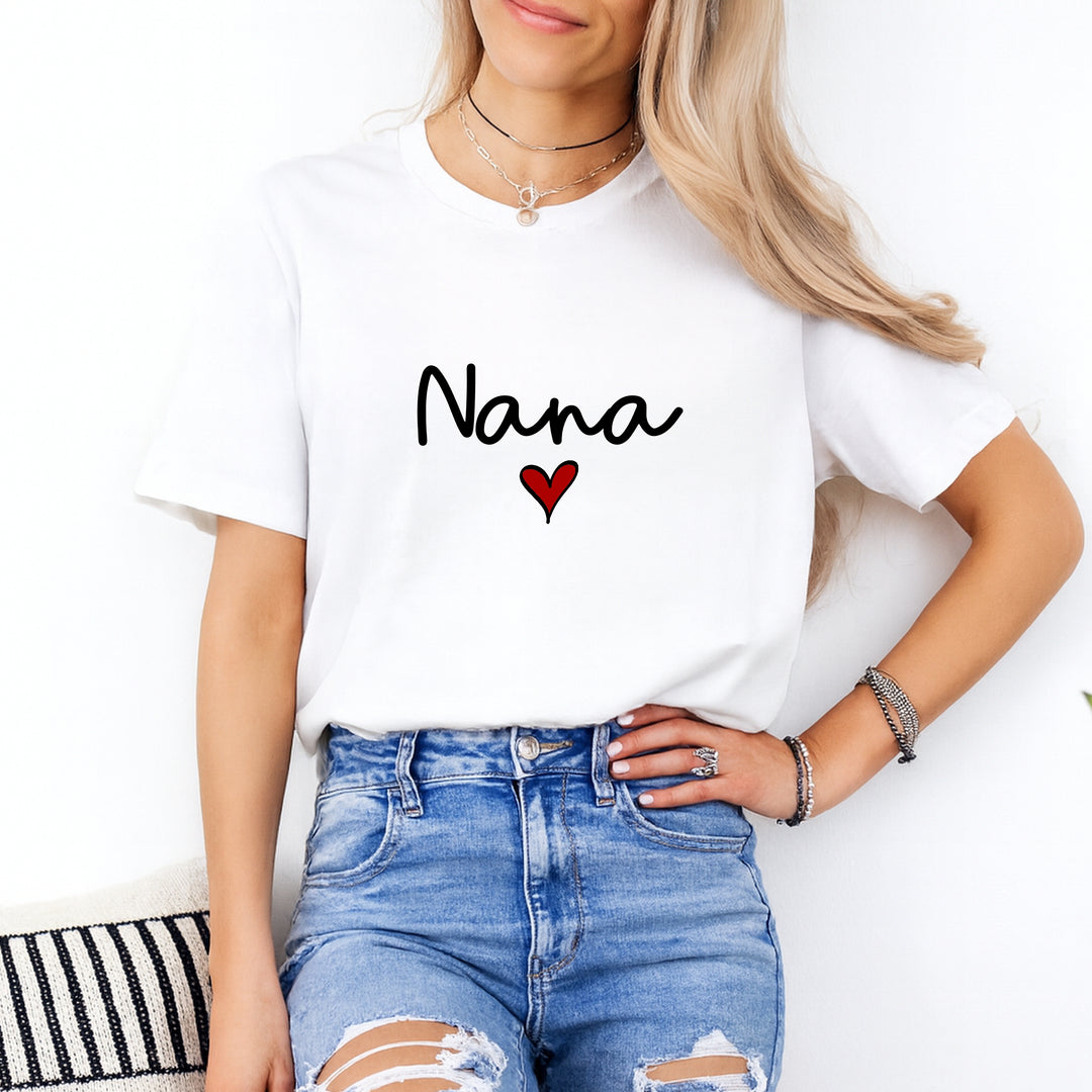 Person wearing a white t-shirt with 'Nana' and a heart design, standing against a white background.