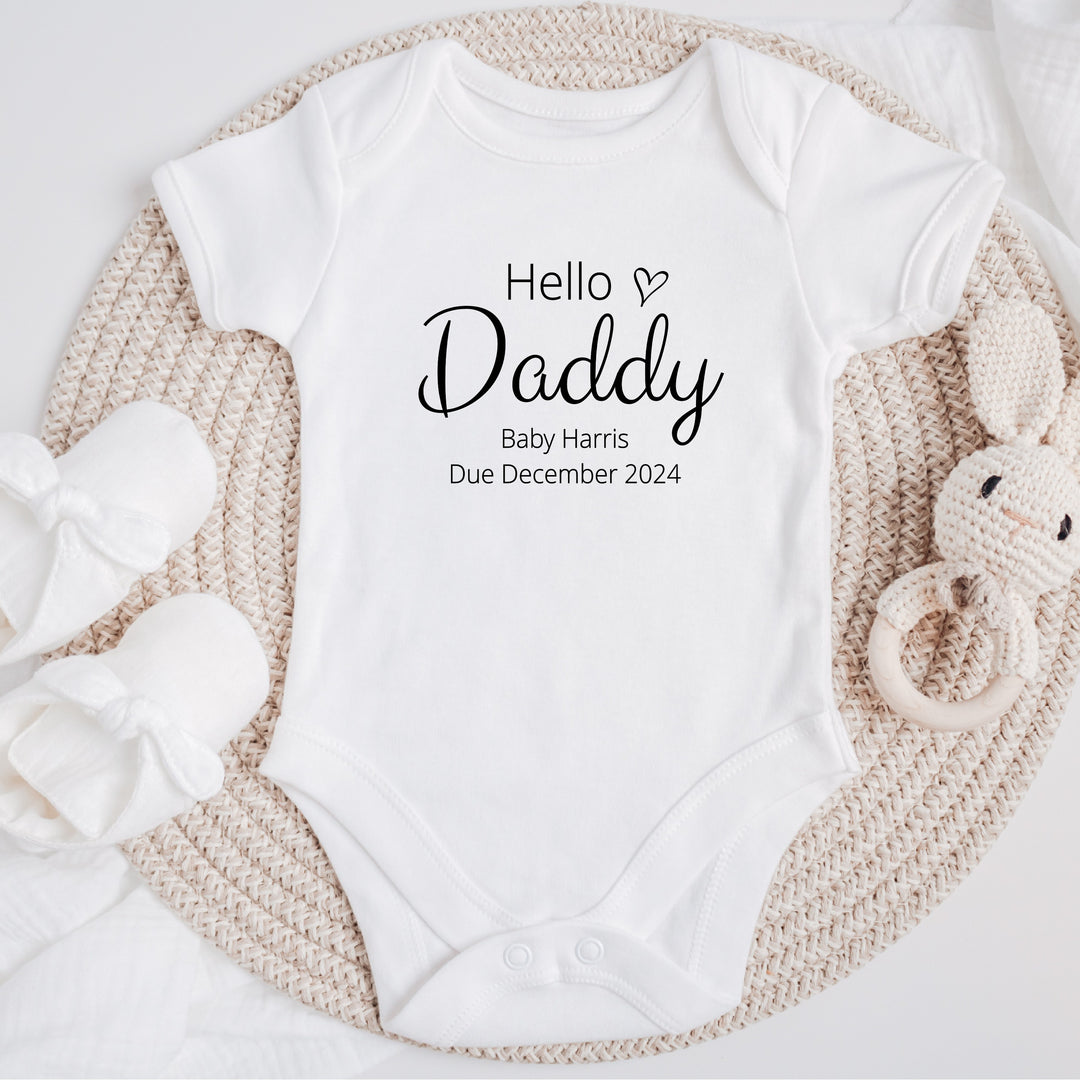 Baby announcement vests that says: Hello Daddy Baby Harris Due December 2024