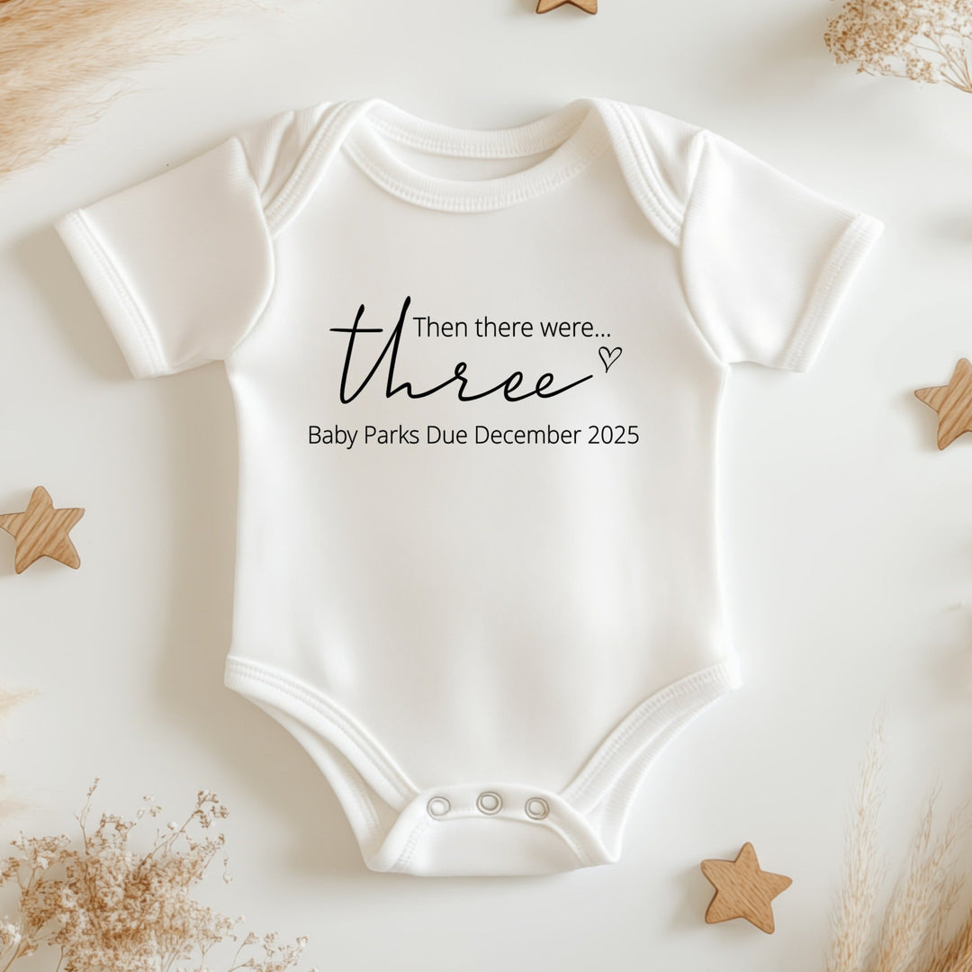 Baby announcement vests that says: Then there were three Baby Parks Due December 2025
