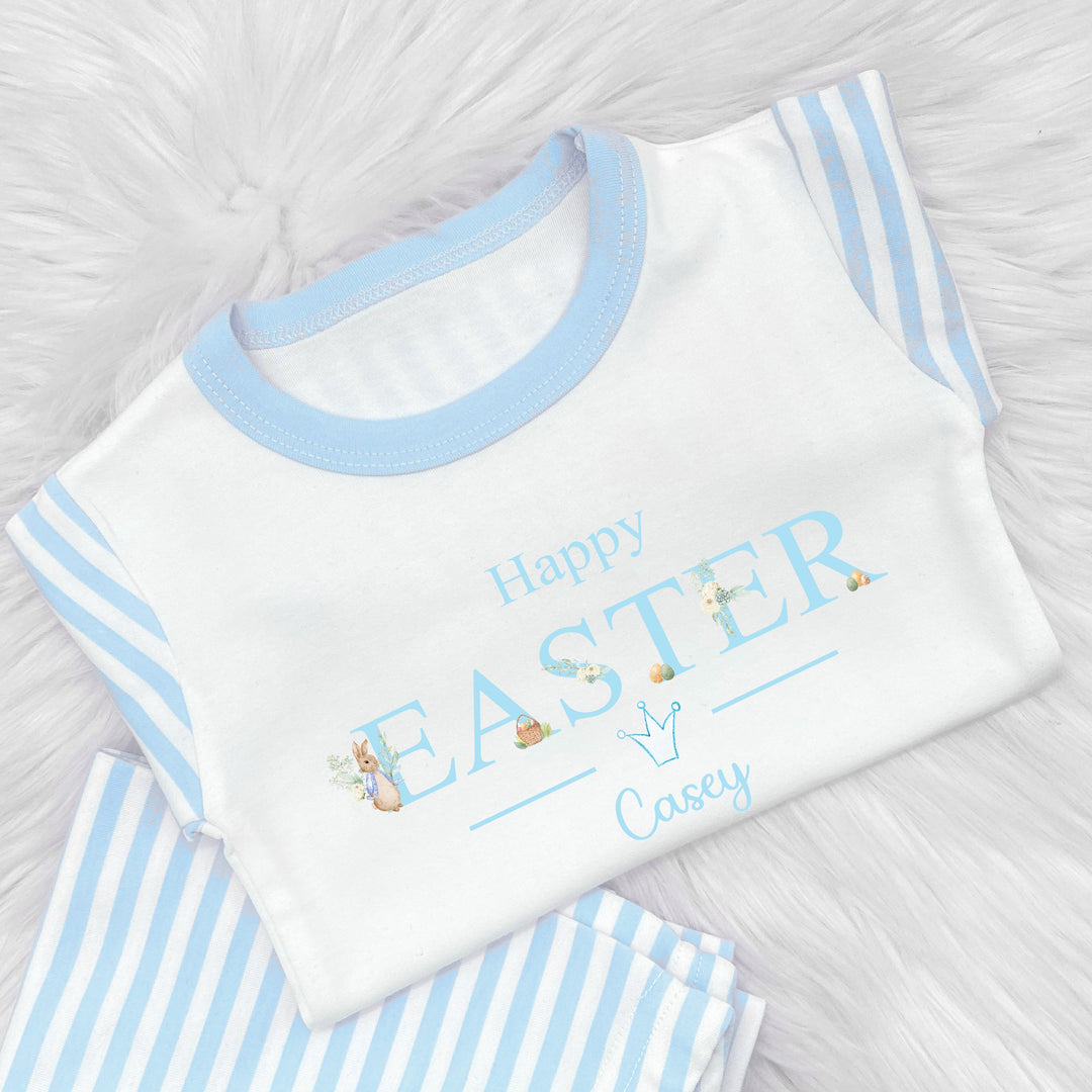 Peronalised blue striped happy easter pyjamas saying 'Happy Easter Casey' This design features a rabbit wearing a blue jacket