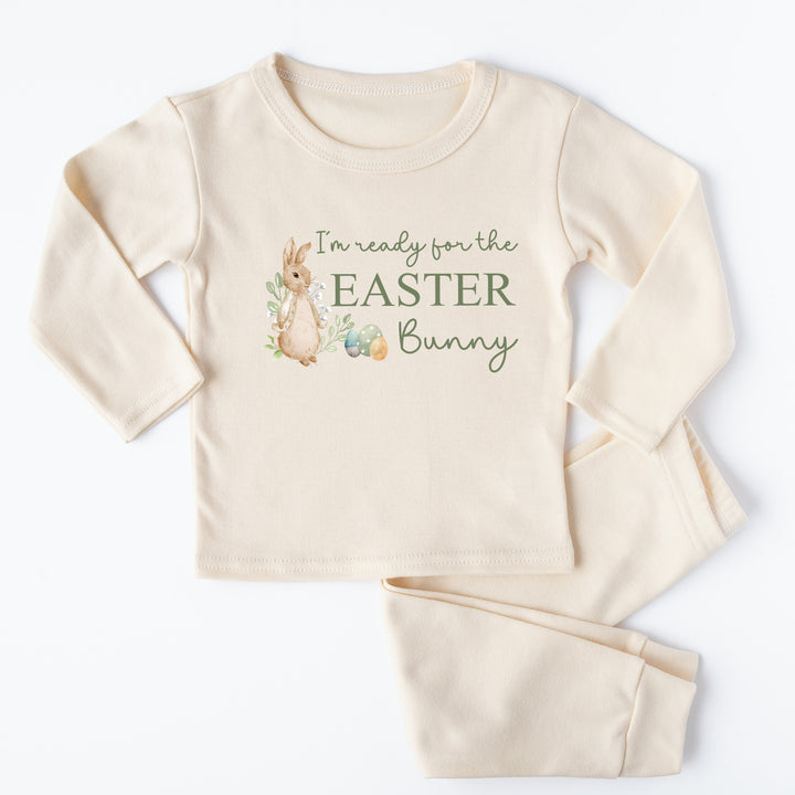 Personalised beige pyjamas that says 'I'm ready for the Easter Bunny'. This design features a rabbit wearing a beige jacket surrounded by easter eggs