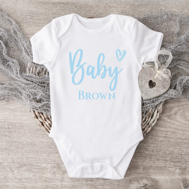 Baby announcement vests that says: 
Baby Brown in blue with a heart