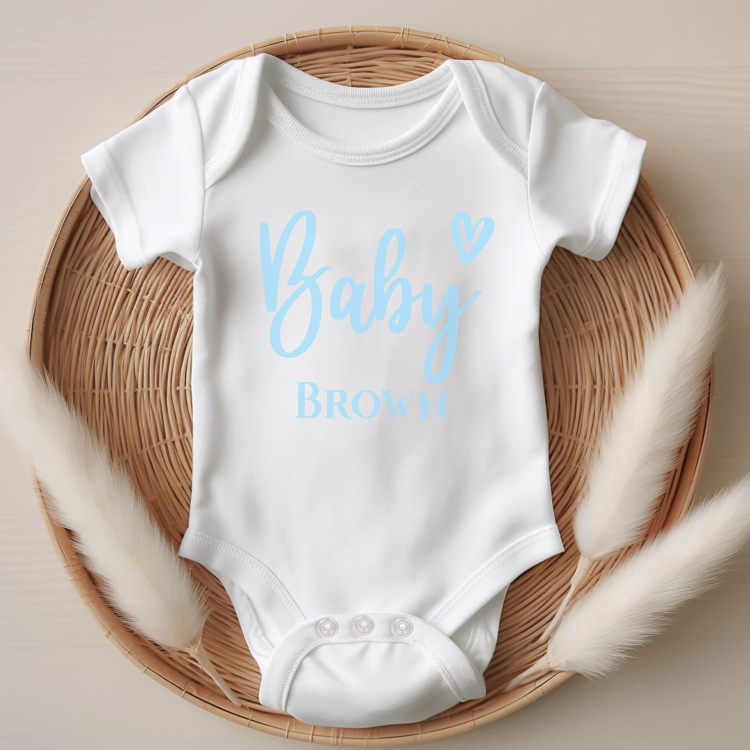 Baby announcement vests that says: 
Baby Brown in blue with a heart