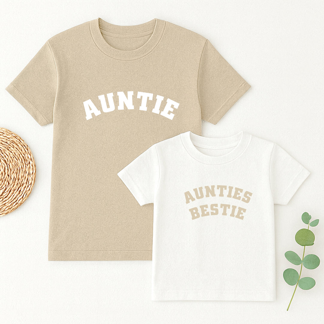 Beige and white t-shirts with 'Auntie' and 'Aunties Bestie' text on a white background.