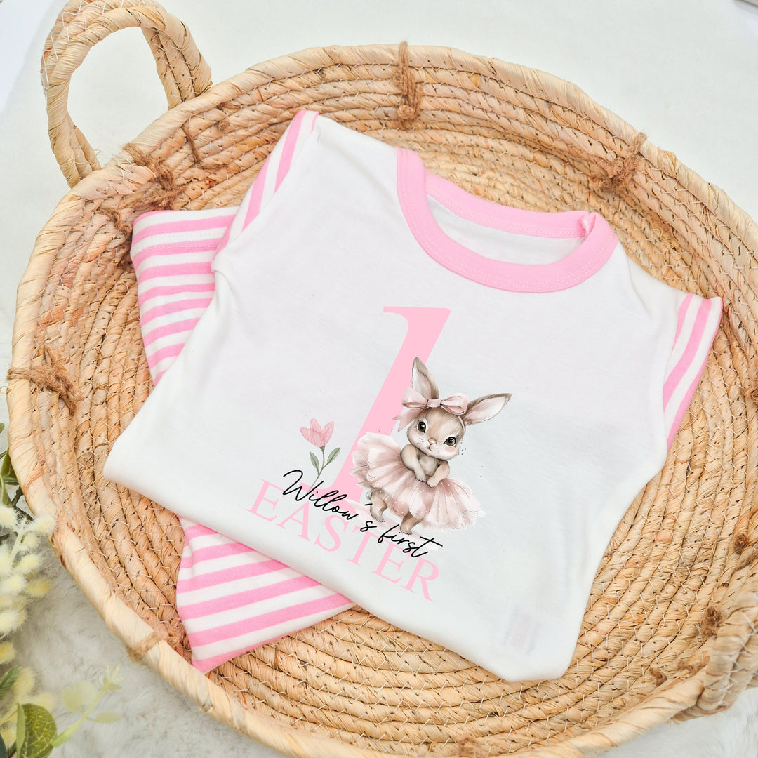 Personalised pink stripe Easter pyjamas that say '1 Willow's first Easter'. This design features a ballerina bunny 