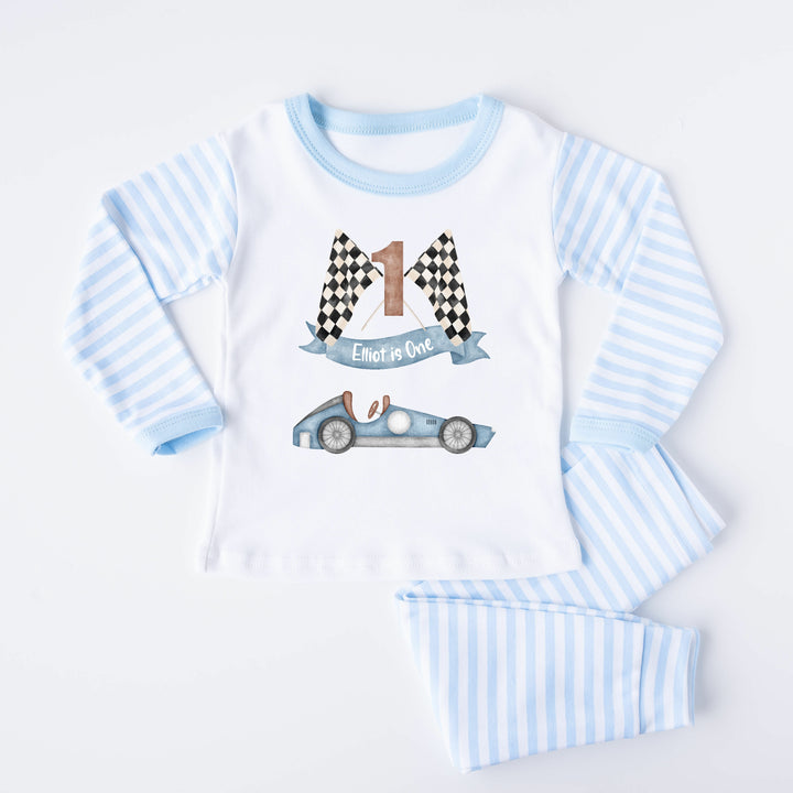 Blue Stripe birthday pyjamas that say 'Teddy is Two'. This design features a blue racecar 