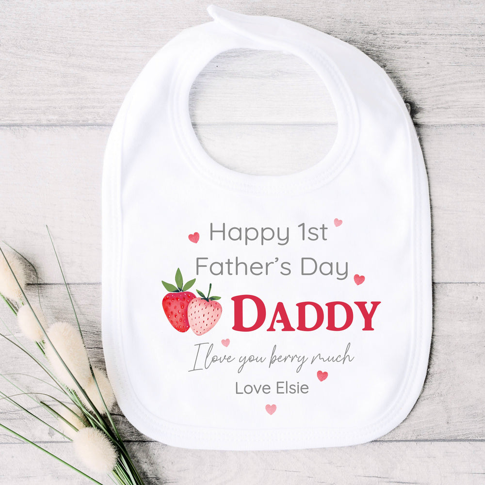 Personalised white Father's Day baby bib that says 'Happy 1st Father's Day Daddy I love you berry much Love Elsie'. This design features 2 strawberries and pink hearts