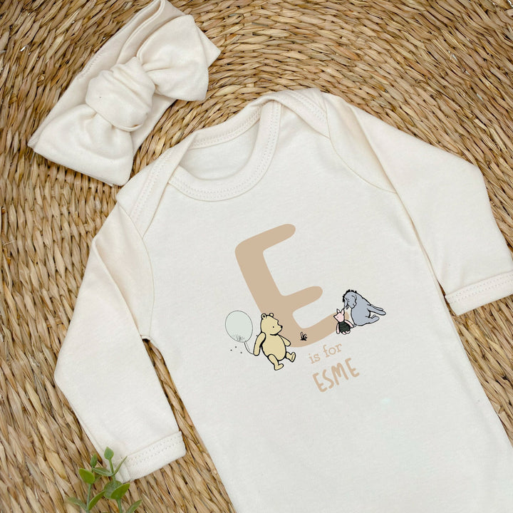 Personalised Beige Winnie the Pooh Initial Babygrow with optional Headband, Hat, Blanket