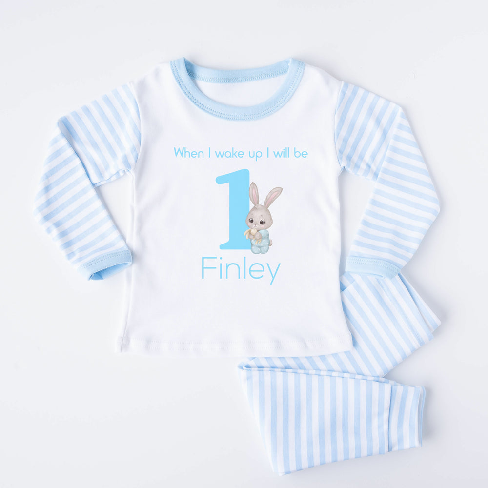 Blue Stripe birthday pyjamas that say 'When I wake up I will be 1 Finley'. This design features a big blue 1 and a bunny  in blue pyjamas