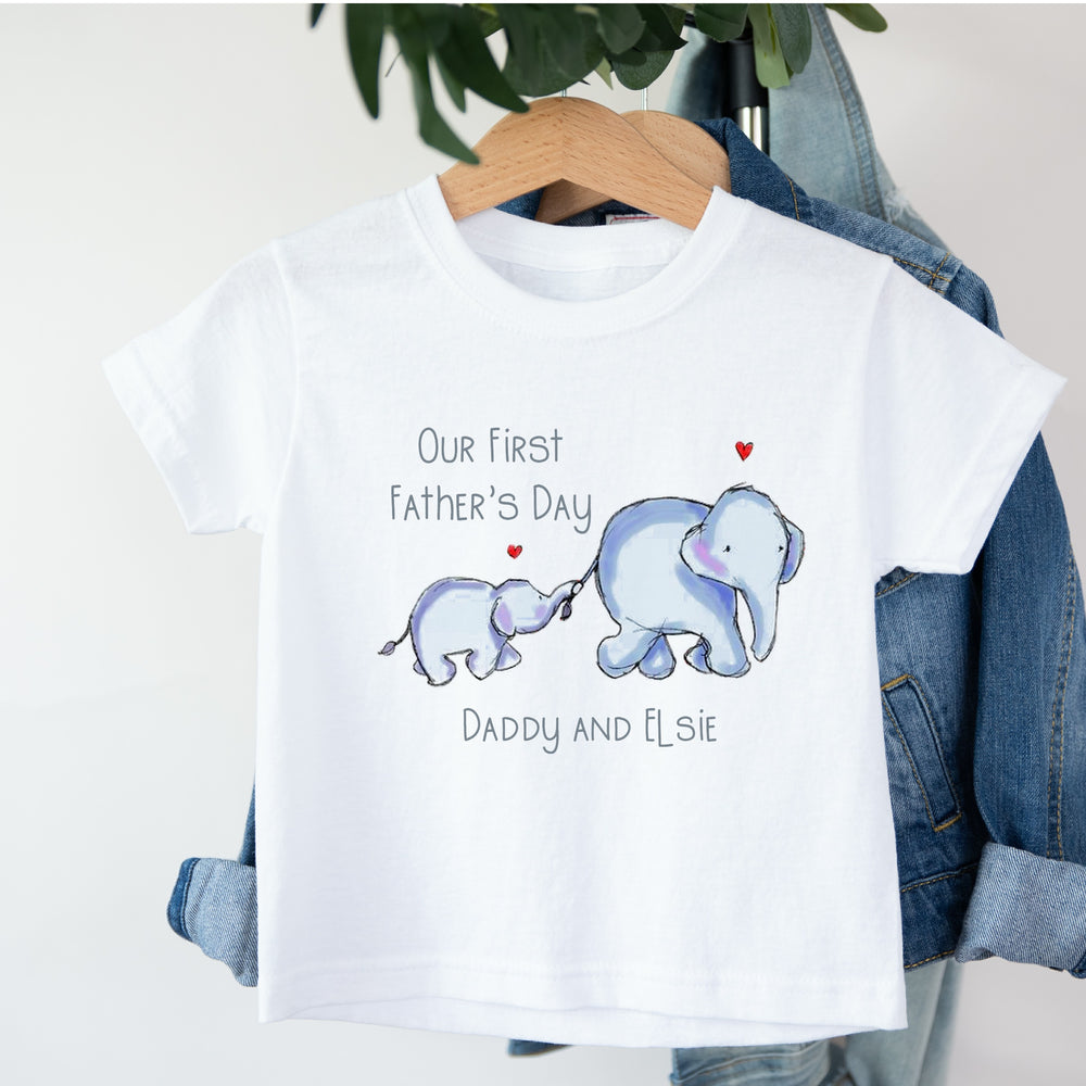 Personalised white Father's Day children's t-shirt that says 'Happy Father's Day Daddy and Kyan'. This design features 2 blue elephants