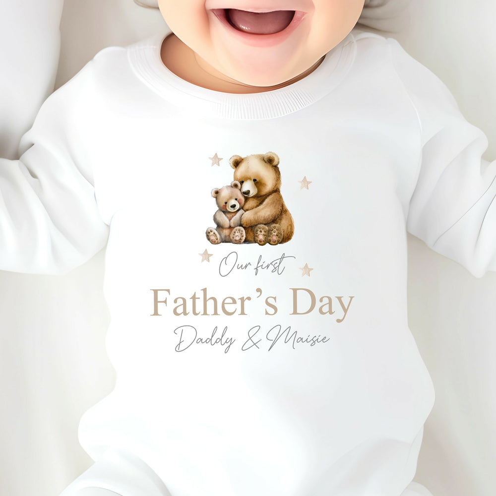 Personalised white Father's Day babygrow that says 'Our First Father's Day Daddy & Maisie'. This design features a daddy bear and a baby bear