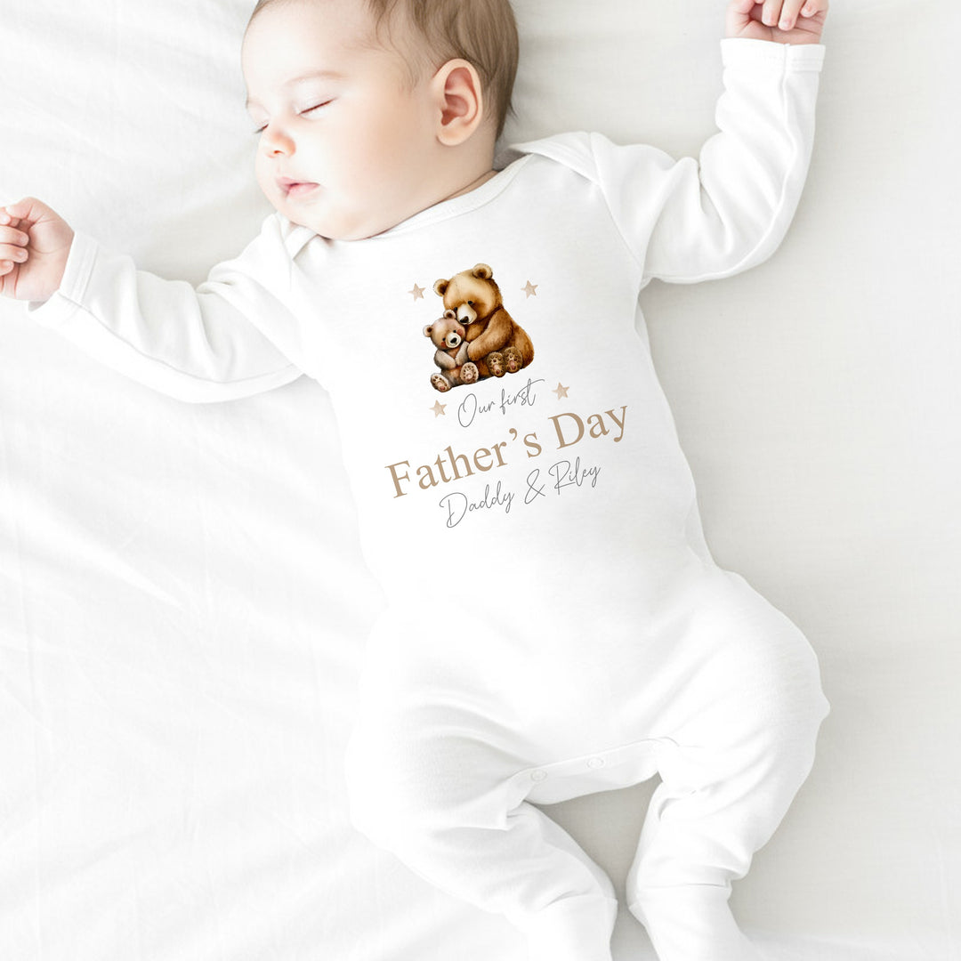 Personalised white Father's Day babygrow that says 'Our First Father's Day Daddy & Riley'. This design features a daddy bear and a baby bear