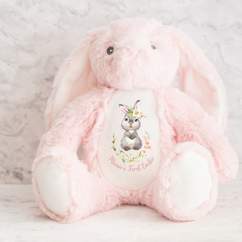 Personalised pink bunny wreath Easter teddy that says 'Maisie's First Easter'. This design features a grey bunny in a pink floral wreath