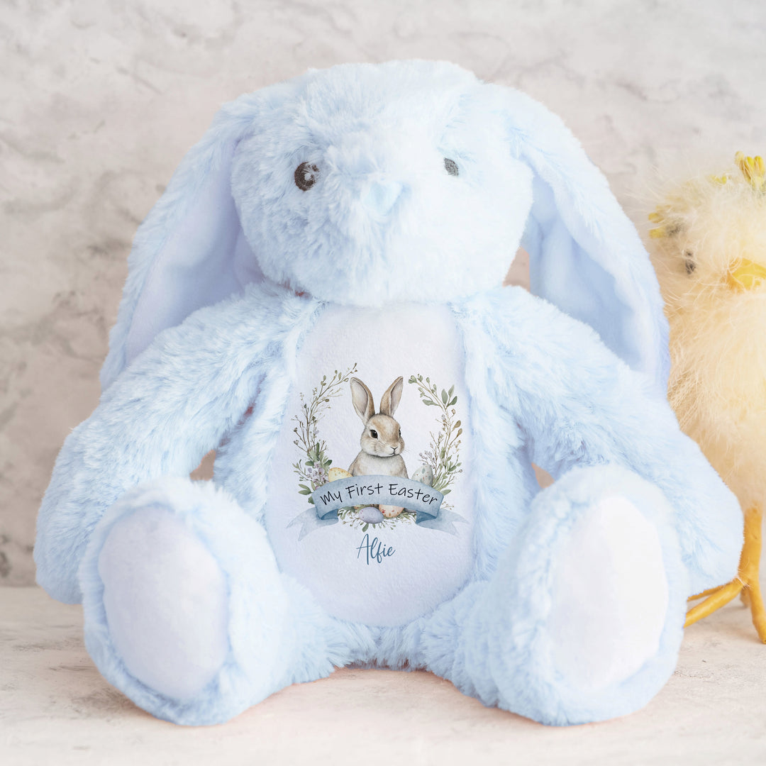 Personalised blue bunny Easter teddy that says 'My First Easter Alfie'. This design features a grey bunny in a wreath