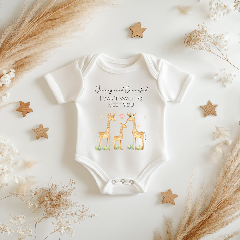 Baby announcement vests that says: Nanny and Grandad I can't wait to meet you. With three giraffes under the text