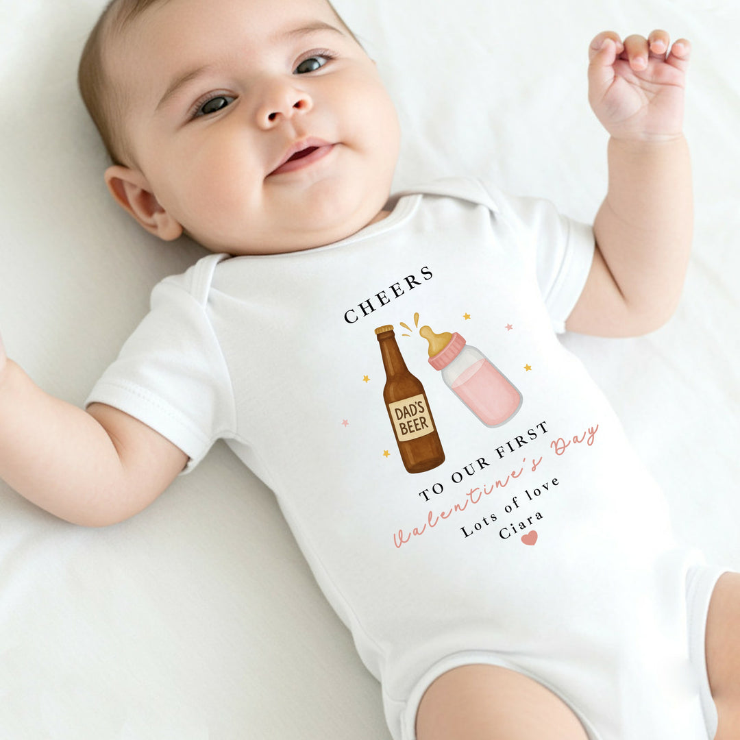Personalised Pink Cheers Our First Valentines Day Baby Grow, Vest or Bib