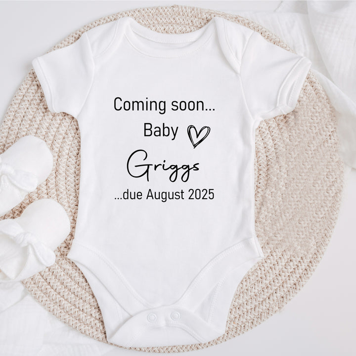 Baby announcement vests that says: Coming Soon... Baby Griggs ...due August 2025