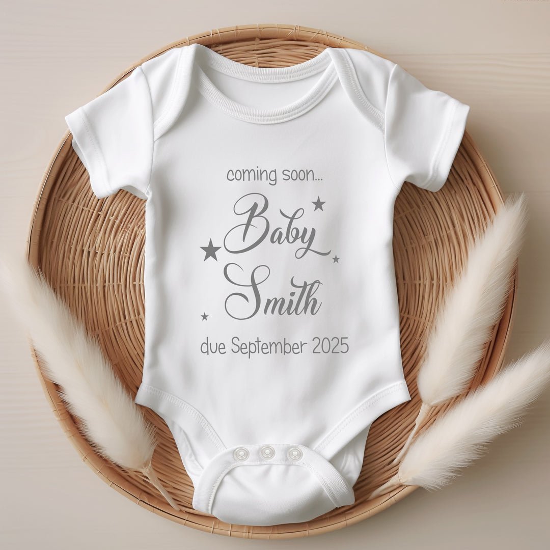 Baby announcement vests that says: Coming soon... Baby Smith due September 2025