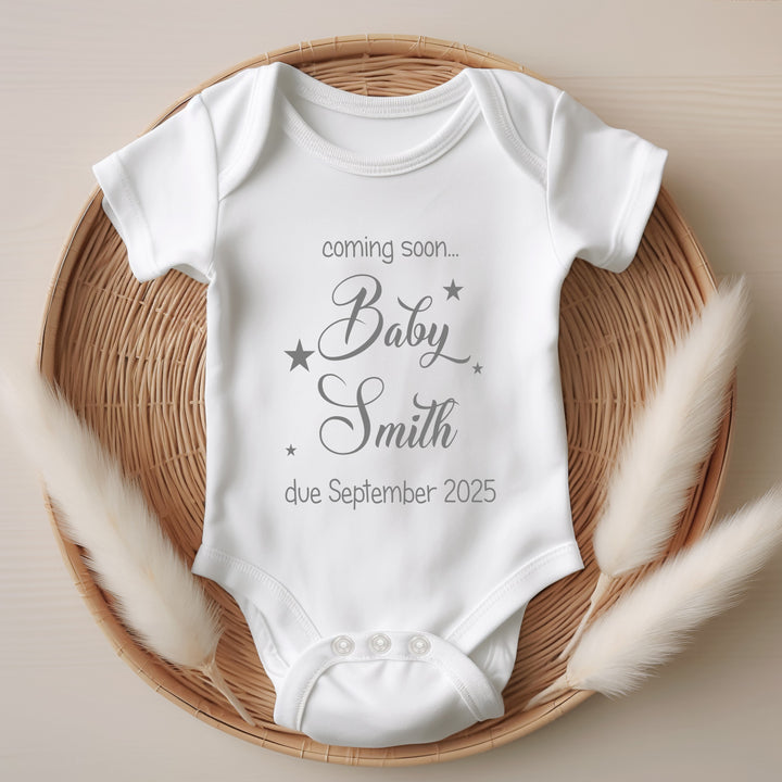 Baby announcement vests that says: Coming soon... Baby Smith due September 2025