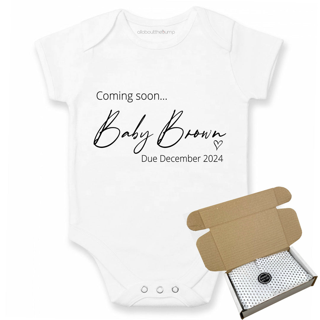 This baby announcement vest can be brought in a box lined with tissue paper