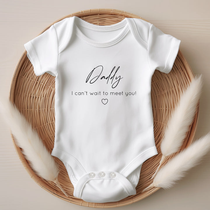 Baby announcement vests that says: Daddy I can't wait to meet you! With a small heart under