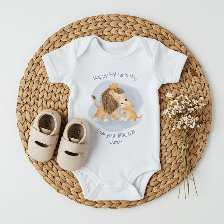 Personalised white Father's Day baby vest that says 'Happy Father's Day Love your little cub Jaxon'. This design features a Lion and his cub