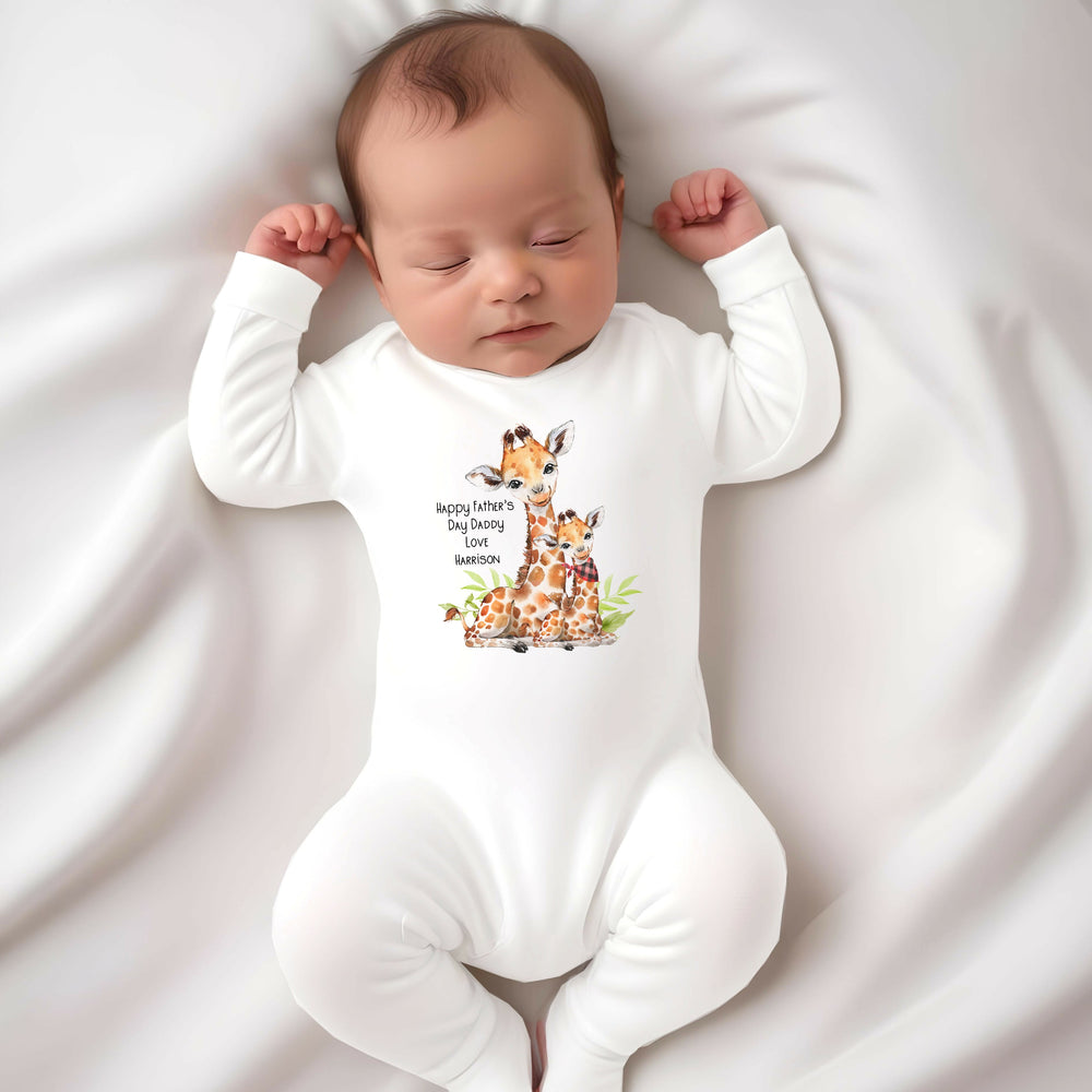 Personalised white Father's Day baby grow/sleepsuit that says 'Happy Fathers's Day Daddy Love Harrison'. This design features 2 giraffes, one of which is wearing a bandana