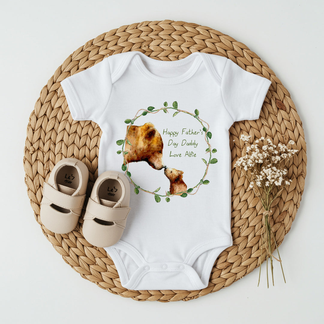 Personalised white Father's Day baby vest that says 'Happy Father's Day Daddy Love Alfie'. This design features 2 brown bears